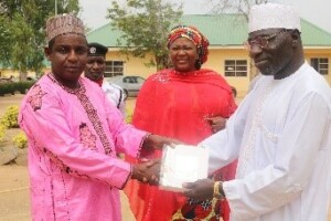Fistula Advisory Committee Chair presents donated family planning commodities to Ningi National Obstetrics Fistula Center Managing Director
