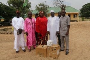 Bottom: Fistula Center key officials pose with donated commodities. Photo Credit: Boniface Kassam, IHP
